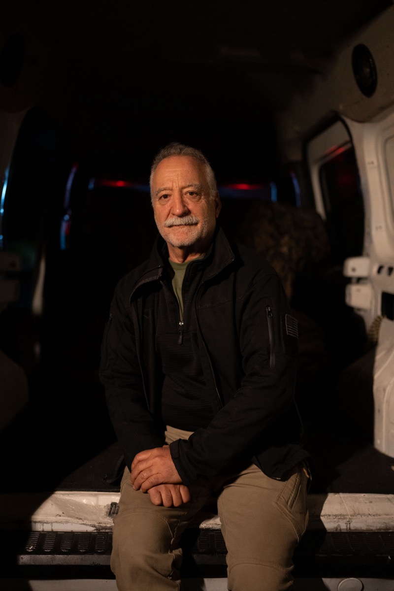 Jon Barocas seated in a field vehicle during rescue support work.